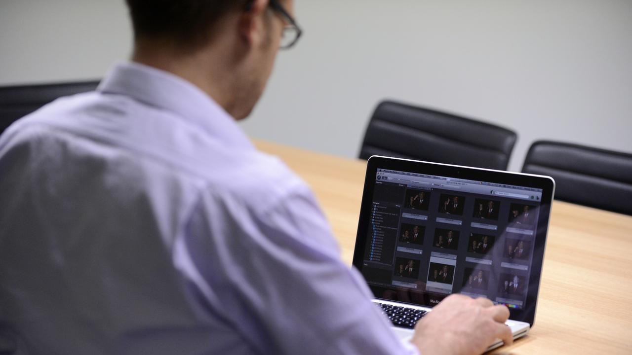 A man using a laptop computer at a desk