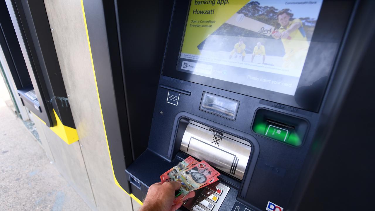 Cash is withdrawn from a Commonwealth Bank ATM in Brisbane
