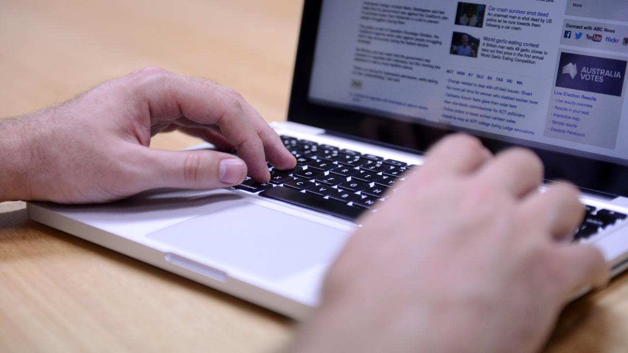 A man uses a laptop computer